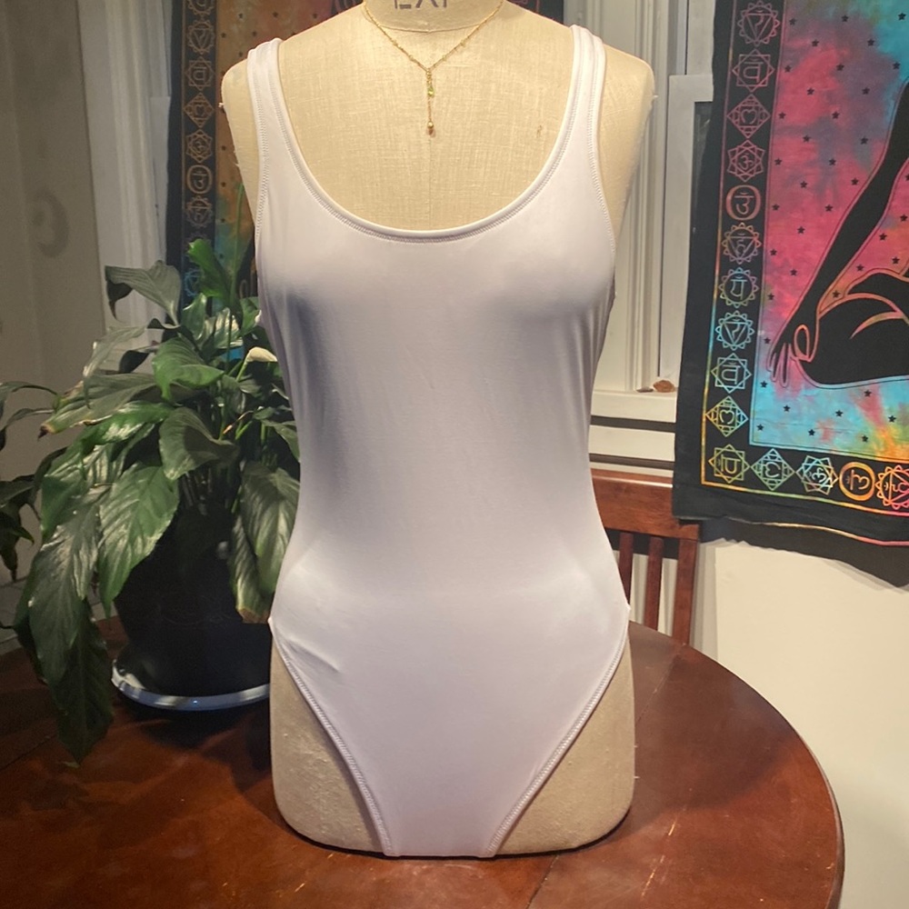 Pink active one piece white swimsuit. Size large.